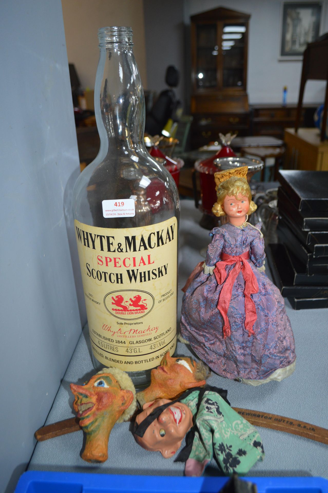 Puppet, Dolls, and a Whiskey Bottle