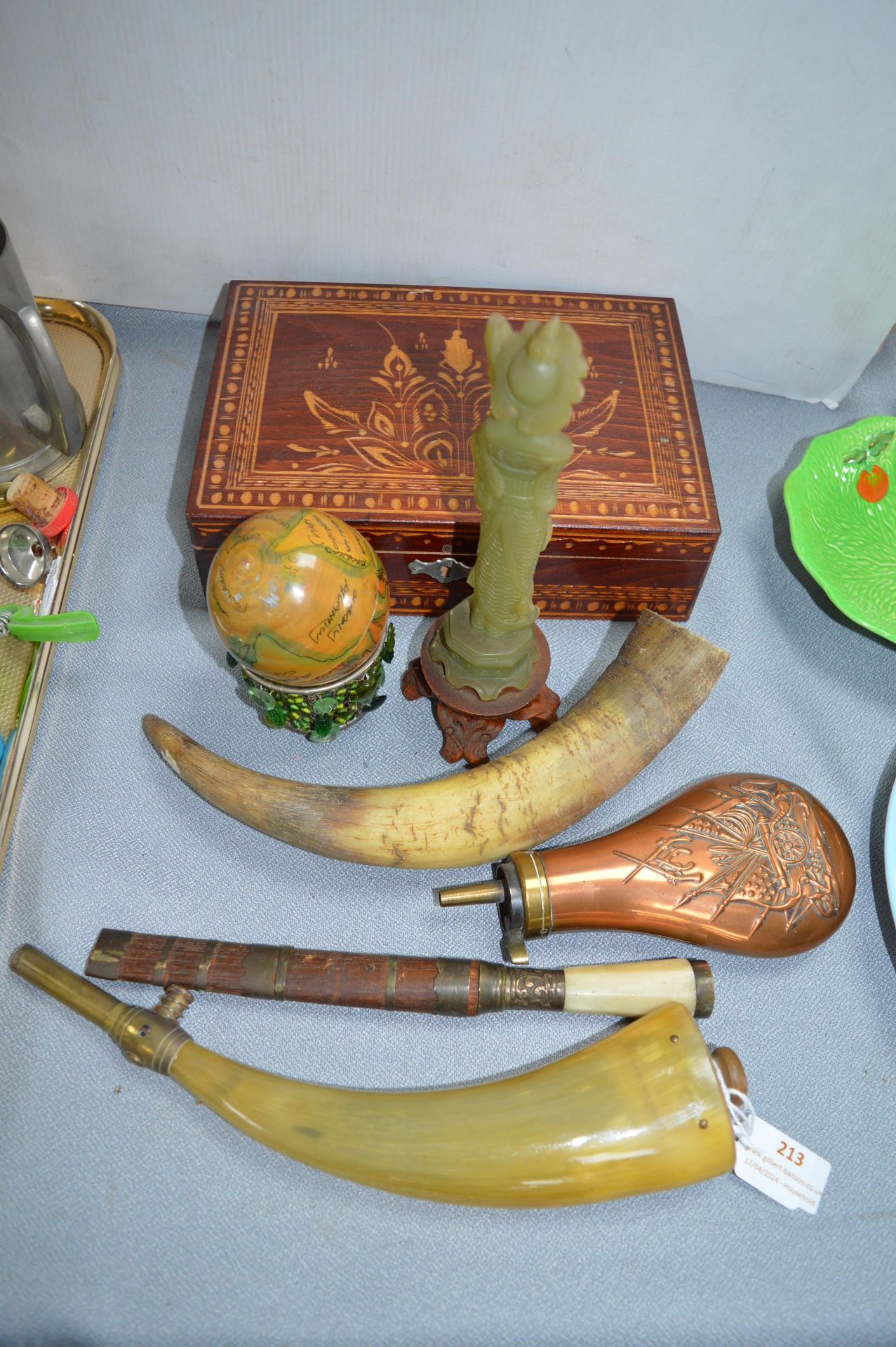 Two Powder Flasks and Decorative Items