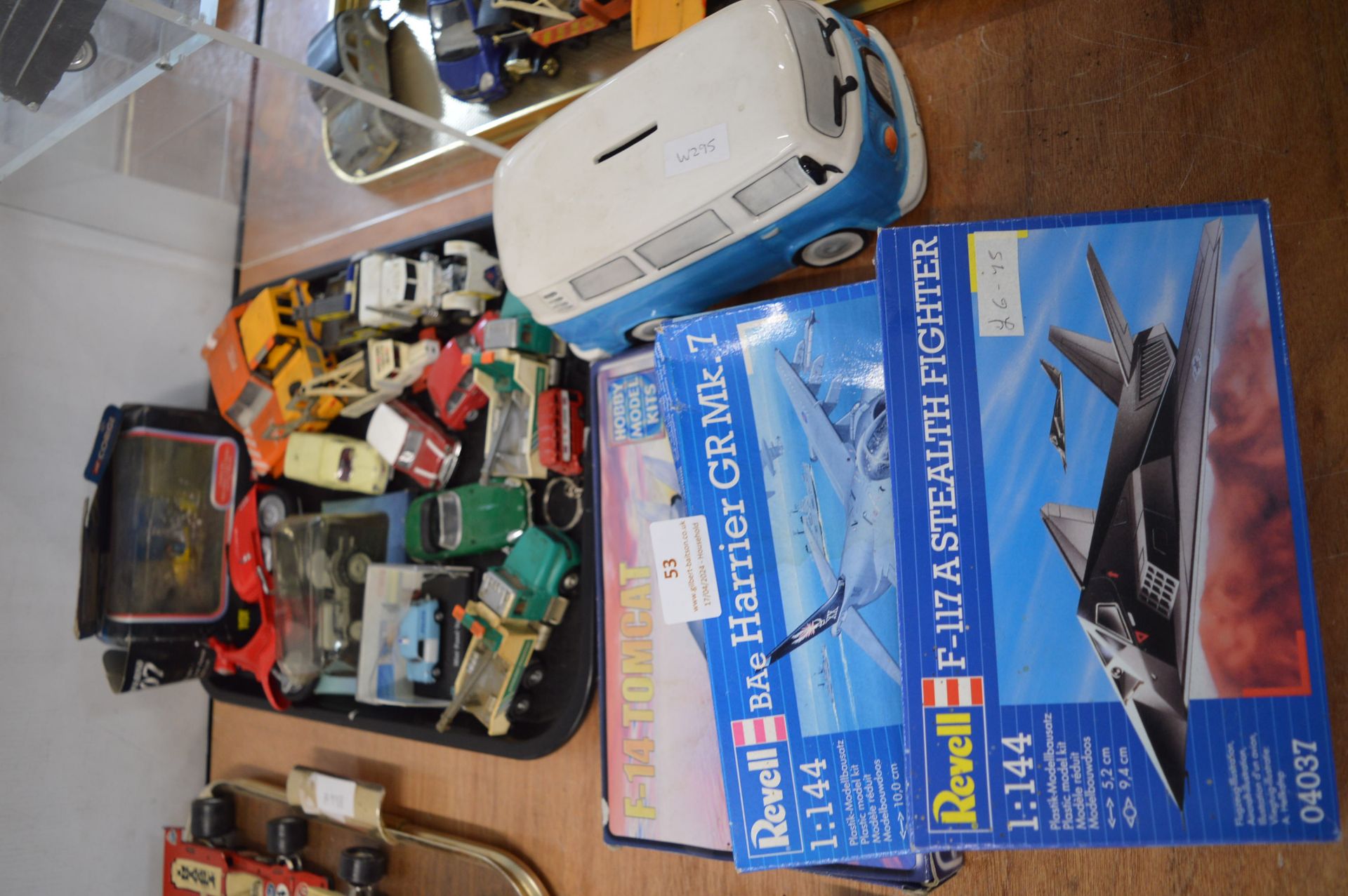 Diecast Vehicles, Model Airplane Kits, and a Money