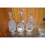 Three Cut Glass Decanters and Three Brandy Goblets