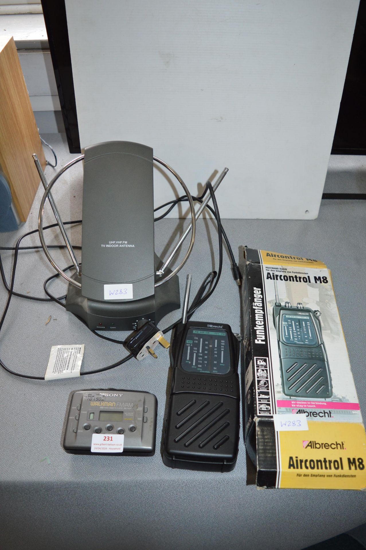 Sony Walkman, Multiband Radio, and an Indoor TV An