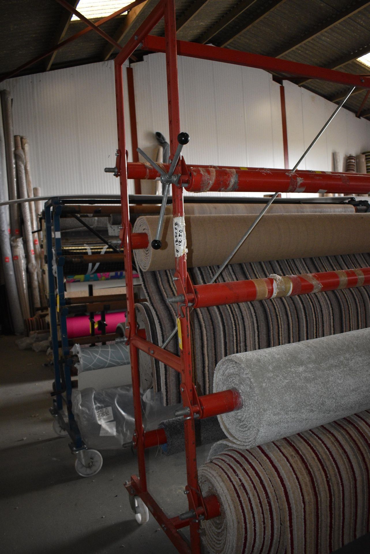 Eight Pole Carpet Rack with Turning Handles, and Castors 4.5m long x 2.2m tall (contents not