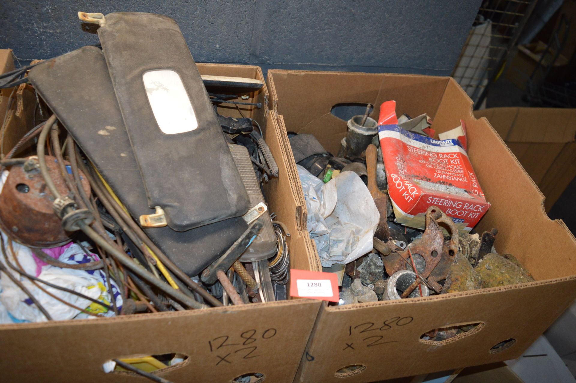 Two Boxes of Various Mini Parts Including Wiper Blades, Speedometer, Cabling, etc.