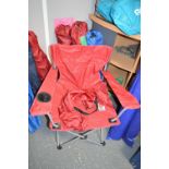 Five Red and One Blue Folding Camping Chairs