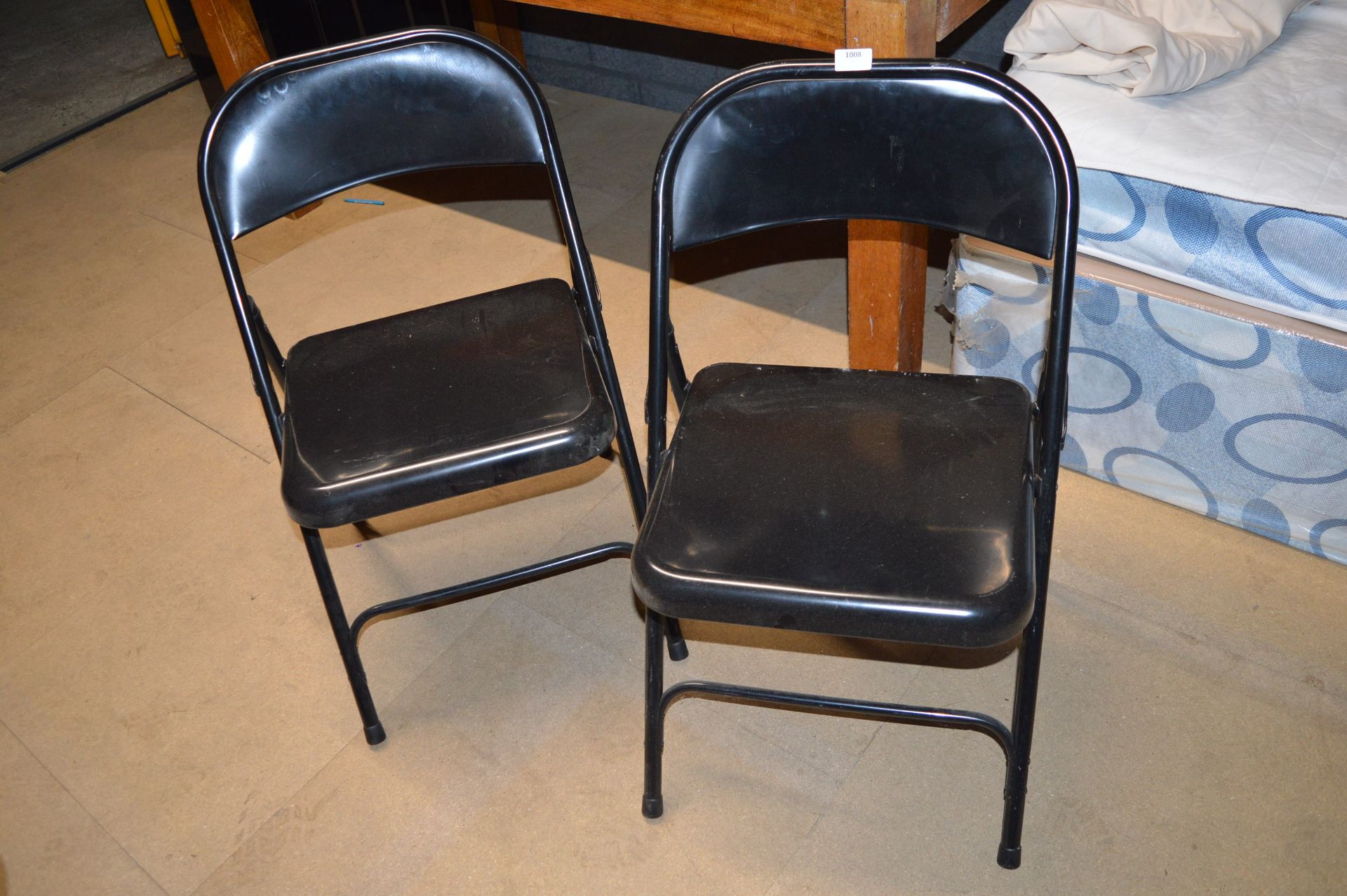 Two Black Folding Steel Chairs