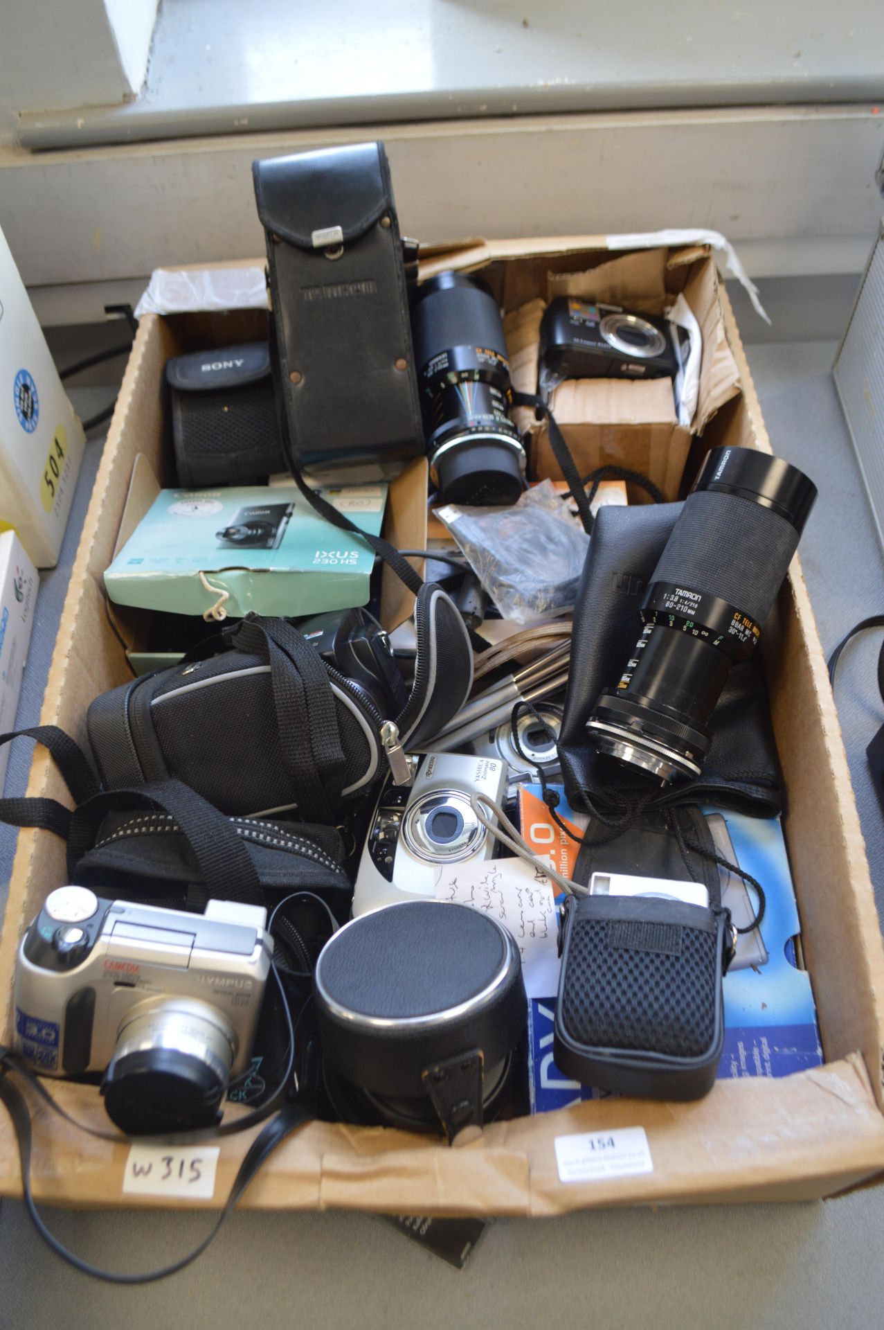 Assorted Digital Cameras and Lenses