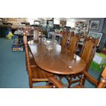 Extending Oval Dining Table with Eight Highback Solid oak dining chairs(Sculpture not included)