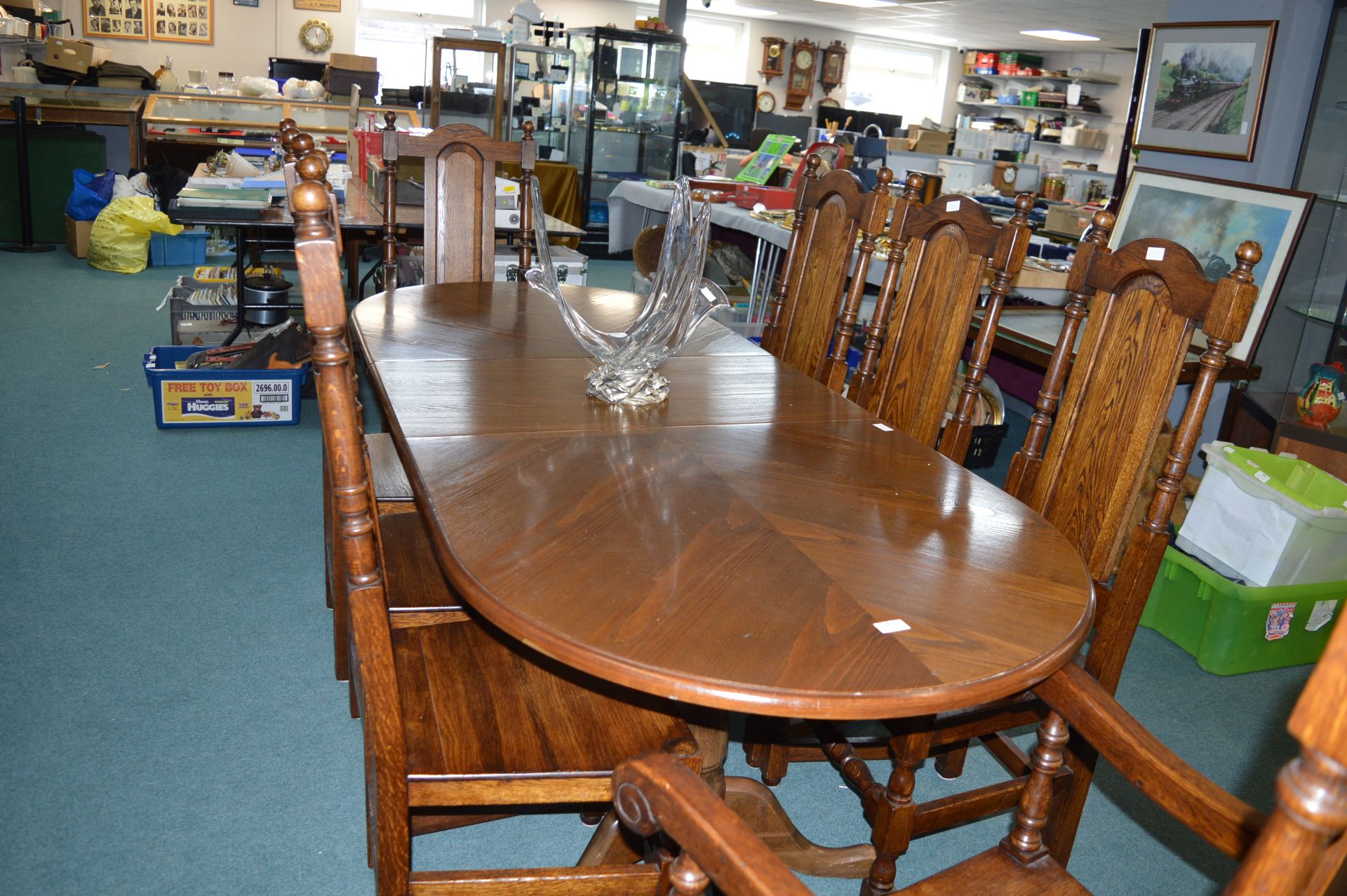 Extending Oval Dining Table with Eight Highback Solid oak dining chairs(Sculpture not included)