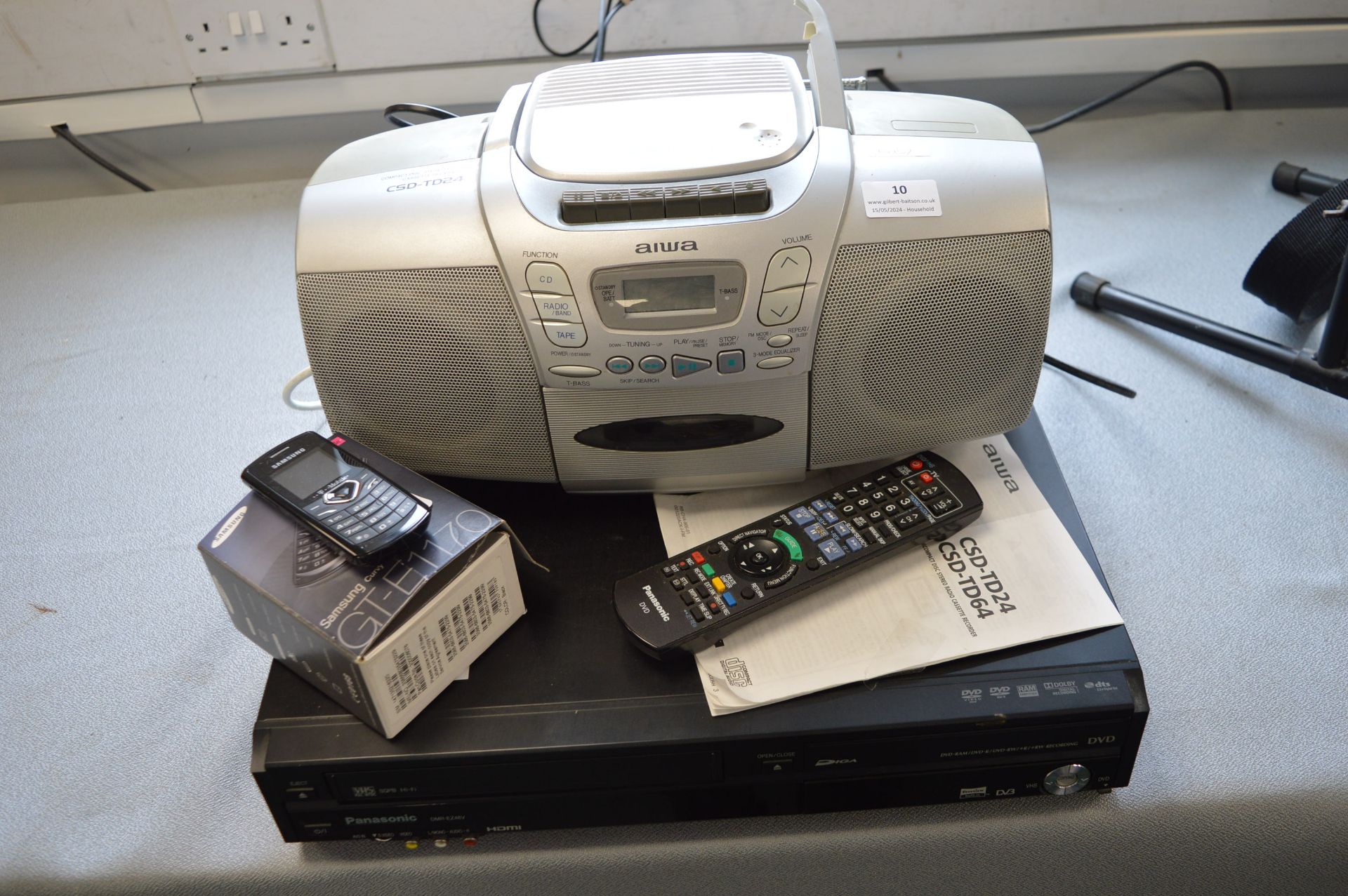 Panasonic DVD/VHS Player, Samsung Mobile Phone, an