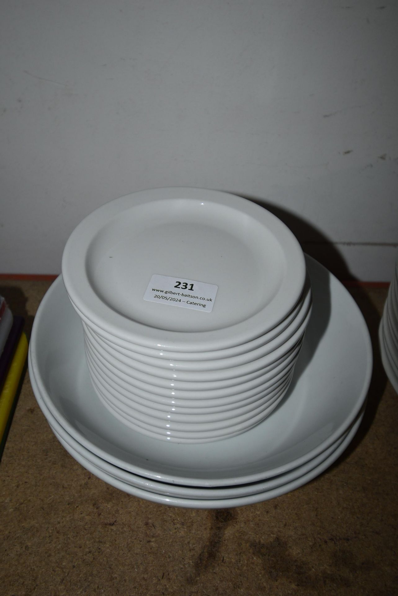 Twelve Small White Platters and Three White Bowls