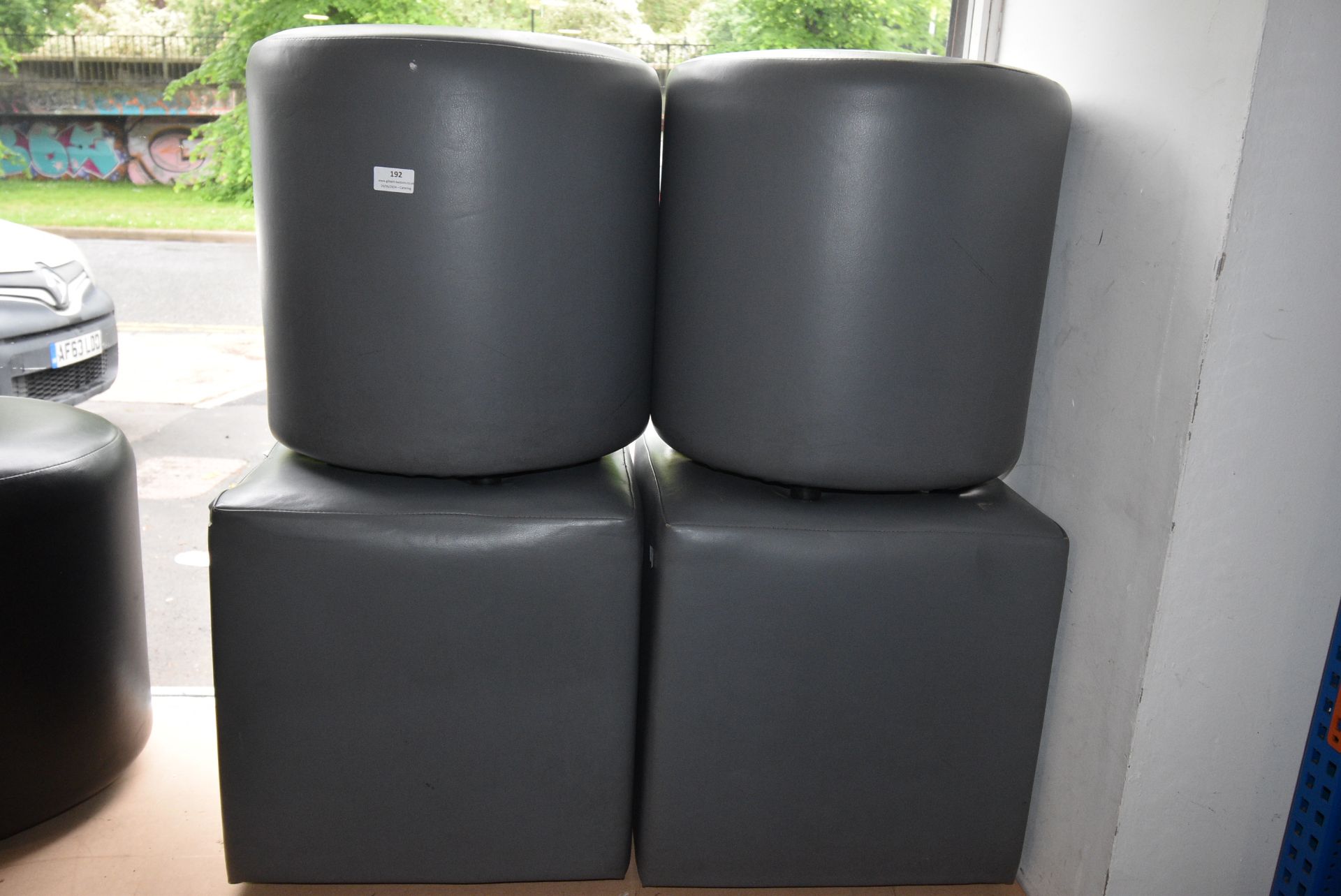 Two Square and Two Circular Grey Pouffes