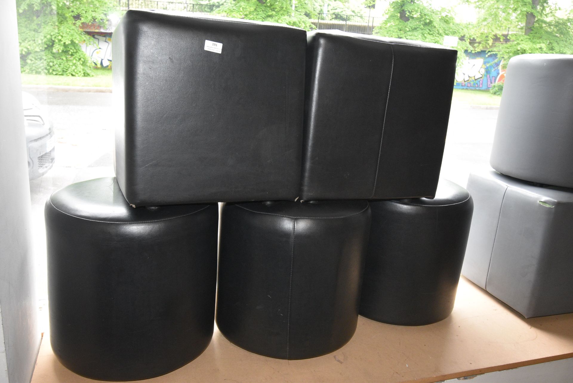 Two Square and Three Circular Black Pouffes