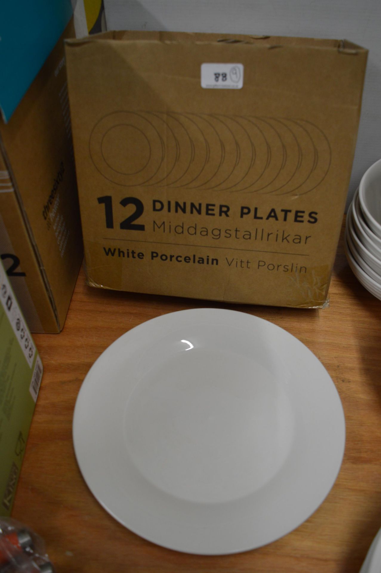 *Nine White Porcelain Dinner Plates