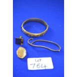 Rolled Gold Items Including Two Bangles, a Locket, and a Cufflink