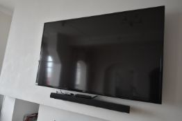 *Samsung Wall Mounted TV with Panasonic DVD Player, LG Soundbar, and Subwoofer