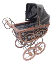 A wicker and steel doll's pram.