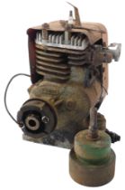 A red cased Suffolk lawn mower engine, with arched turn, and ring bell marked Suffolk Iron Foundry