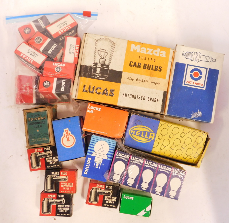 A group of automobile parts, to include Mazda, Philips, Lucas, and other bulbs and spark plug supres - Image 3 of 3