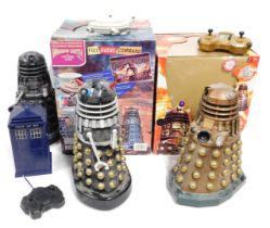 Three Doctor Who remote controlled Daleks, and an electronic Tardis. (4)