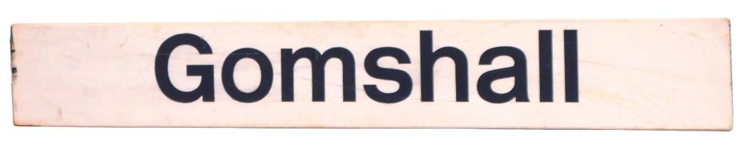 A Gomshall plastic and wooden backed platform sign, on a white ground, 30cm high, 207cm wide. (AF)