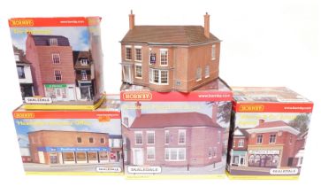 A group of Hornby OO gauge Skaledale buildings, comprising Headingly Insurance, The Pharmacy, Warren