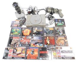 A Sony Playstation, with controllers, accessories and games, including Alien Trilogy, Alien Resurrec