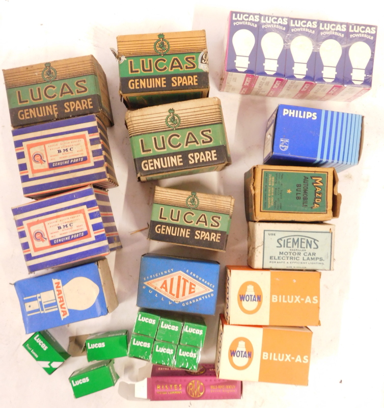 A group of automobile parts, to include Mazda, Philips, Lucas, and other bulbs and spark plug supres - Image 2 of 3