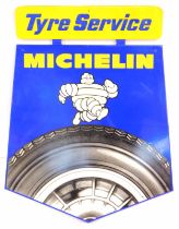 A Michelin Tyre Service metal advertising sign, with arched base set with tyre and Michelin Man, on