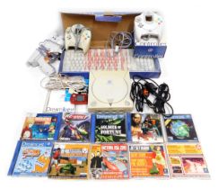 A Sega Dreamcast, with controllers, keyboard, and games, including House of the Dead 2, ChuChu Rocke