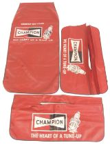 Three Champion red leatherette seat covers, marked Courtesy Seat Cover Champion The Heart of a tune