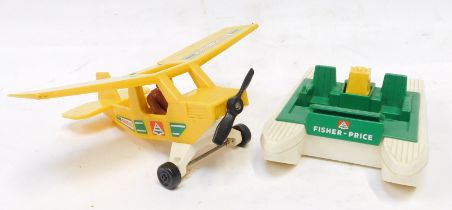 A Fisher Price bi-plane, and a Fisher Price boat. (2)