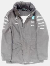 A Mercedes F1 waterproof jacket, size medium, with Petronas, Hugo Boss, Pirelli and Bose sponsorship