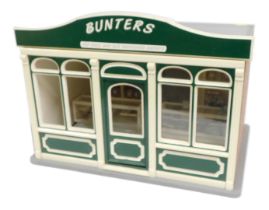 A model of Bunters Top Chocs and Old Fashion Sweets shop, 1:12 scale, with cabinets, furniture and o