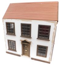 A Georgian style doll's house and furniture.