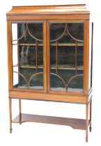 An Edwardian mahogany and satinwood cross banded display cabinet, the tapering top with chequer band