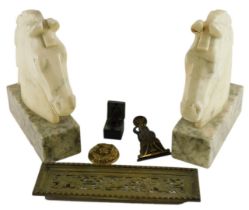 A pair of alabaster carved horse's heads, each on a rectangular base, 25cm high, a letter clip, etc.