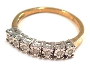 A 9ct gold seven stone diamond dress ring, set with seven illusion tiny diamonds, in a raised white