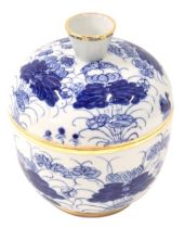 A 19thC Chinese blue and white jar and cover, with blue floral design and gilded border, with four c