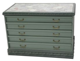 A Continental green painted chest of drawers, the glazed top inset with floral fabric panel and with