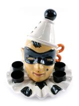 A Pucci pottery liqueur set, modelled in the form of a clown or pierrot, numbered 1575, 23cm high. (
