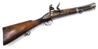 An early 19thC East Indian Company flintlock blunderbuss, the side lock plate dated 1811 and with ra