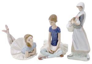Three Lladro figures, comprising a seated ballerina, a lady standing with hen and basket, and a blue