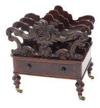 A Victorian rosewood Canterbury, with three pierced and scroll shaped divisions above a drawer, on t