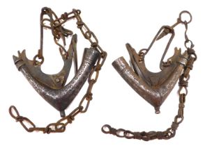 Two 19thC Islamic Arabic priming iron powder flasks, each with hanger and chain.