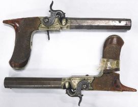 A pair of 19thC saw-handled dueling pistols by F W Bailey of London, with engraved hammers and box l