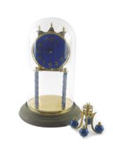 A German gilt brass and blue decorated anniversary clock, with glass dome and domed foot, 27cm high.