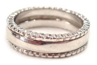 A 9ct white gold wedding band, with a beaded border, ring size Q, 7.6g all in.