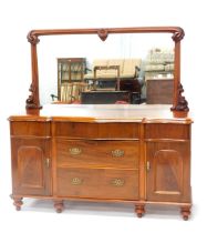 A late Victorian mahogany sideboard, with mirror back, the serpentine fronted top with a moulded edg