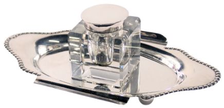 A silver plated inkstand, with a fluted and reeded tray, with two pen slips, and central square inkw