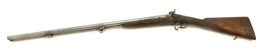 A 19thC Continental double barrel hammer action sporting gun, with engraved hammers and lock plates,